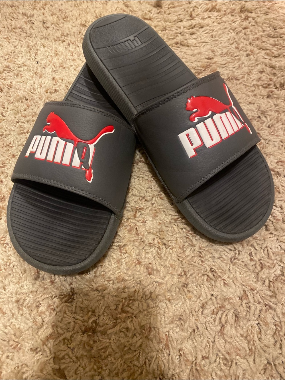 Puma Black Slides with Red Logo Accent